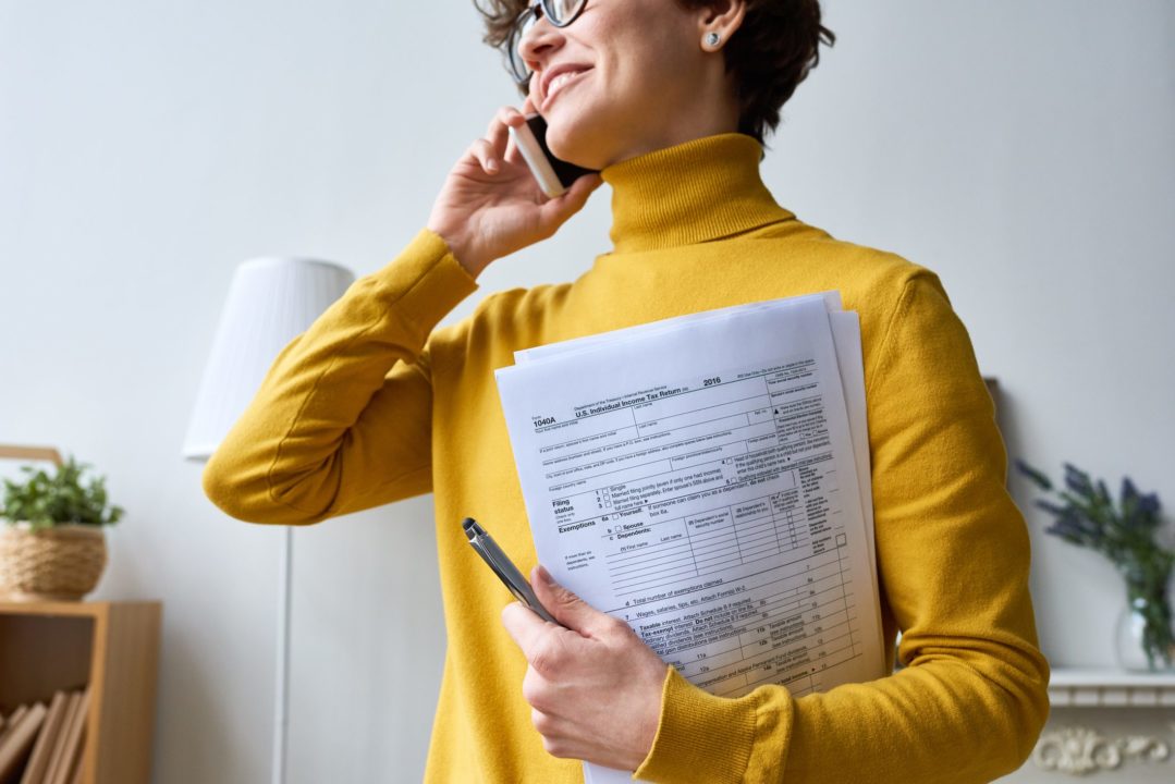 Woman with individual tax return Individual income tax preparation